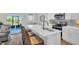 Contemporary kitchen with a spacious island, stainless steel appliances, and ample counter space at 13622 Wolfpack Rd, Hudson, FL 34667