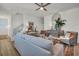 Bright living room features modern decor, neutral tones, and stylish furnishings for a comfortable and inviting atmosphere at 13978 Emerald Fields Dr, Hudson, FL 34667