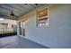 Covered patio features a ceiling fan, sliding glass doors and lighting for evening enjoyment at 14004 Emerald Fields Dr, Hudson, FL 34667