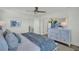 Spacious bedroom featuring light walls, a ceiling fan, and natural light at 14012 Emerald Fields Dr, Hudson, FL 34667