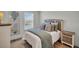 Cozy bedroom with beach-themed decor, natural light, and a comfortable bed at 14012 Emerald Fields Dr, Hudson, FL 34667