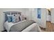 Comfortable bedroom with a neutral color palette, en-suite bath, and walk in closet at 14012 Emerald Fields Dr, Hudson, FL 34667