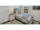 Inviting bedroom featuring serene decor, a twin bed, and a peaceful view at 14012 Emerald Fields Dr, Hudson, FL 34667