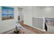 Upstairs hallway with artwork leading to bedrooms, enhancing the home's aesthetic appeal at 14012 Emerald Fields Dr, Hudson, FL 34667