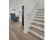 Staircase with luxury vinyl plank flooring, leading from the first to second floor at 14012 Emerald Fields Dr, Hudson, FL 34667