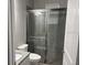 Bathroom featuring a tiled walk-in shower with sliding glass doors at 16617 5Th E Ave, Bradenton, FL 34212