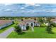 Stunning single-story home with tile roof, lush landscaping, and picturesque lake view at 16617 5Th E Ave, Bradenton, FL 34212
