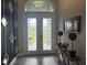 Inviting foyer with decorative glass doors, modern accents, and stylish decor at 16617 5Th E Ave, Bradenton, FL 34212
