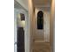 Hallway showcasing an arched niche, white trim, and wood-look tile flooring at 16617 5Th E Ave, Bradenton, FL 34212