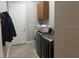 Functional laundry room featuring modern washer, dryer, and storage cabinets at 16617 5Th E Ave, Bradenton, FL 34212