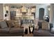 Open-concept living room with a view of the modern kitchen with stainless steel appliances at 16617 5Th E Ave, Bradenton, FL 34212