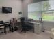 Bright home office with large windows, ample desk space, and views of the outdoors at 16617 5Th E Ave, Bradenton, FL 34212