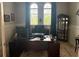 Well-lit home office with desk, computer, and a view to the outside at 16617 5Th E Ave, Bradenton, FL 34212