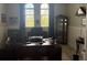 Bright home office featuring custom wood desk, natural light, and classic decor at 16617 5Th E Ave, Bradenton, FL 34212