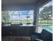 Modern outdoor kitchen with high-end grill, countertop seating, and views of the pool and backyard at 16617 5Th E Ave, Bradenton, FL 34212