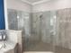 Large, tiled walk-in shower featuring dual shower heads and modern fixtures at 16617 5Th E Ave, Bradenton, FL 34212