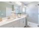 Stylish bathroom featuring a glass enclosed shower and white vanity offers a modern design at 16818 Fiesta Dr, Port Charlotte, FL 33953