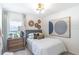 Cozy bedroom featuring stylish decor, a comfortable bed, and natural light from the window at 16818 Fiesta Dr, Port Charlotte, FL 33953