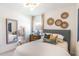 Well-decorated bedroom with stylish mirror, woven baskets, and elegant lighting provides a cozy retreat at 16818 Fiesta Dr, Port Charlotte, FL 33953
