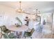 Open-concept dining area adjacent to a modern kitchen with ample seating at 16818 Fiesta Dr, Port Charlotte, FL 33953