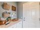 Hallway featuring white cabinets and white countertop with decorative items displayed throughout at 16818 Fiesta Dr, Port Charlotte, FL 33953