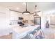 Beautiful kitchen with island seating, white cabinets, and stainless steel appliances at 16818 Fiesta Dr, Port Charlotte, FL 33953