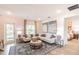Comfortable living room featuring a sectional sofa, decorative rug, and natural light at 16818 Fiesta Dr, Port Charlotte, FL 33953