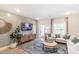 Cozy living room with a comfortable sofa, rug, and a view of the backyard at 16818 Fiesta Dr, Port Charlotte, FL 33953