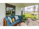 Relaxing outdoor patio with comfortable seating, views of the backyard and lots of sunlight at 16818 Fiesta Dr, Port Charlotte, FL 33953