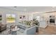 Open concept living room featuring an eat-in kitchen and comfortable seating at 16836 Fiesta Dr, Port Charlotte, FL 33953
