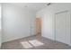 Bedroom featuring neutral carpet, natural light, and closet at 16866 Fiesta Dr, Port Charlotte, FL 33953