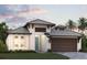 Charming one-story home featuring a two car garage, Bahama shutters and a well-maintained lawn at 200 Vistera Blvd, North Venice, FL 34275