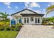 M/I Homes sales center with manicured landscaping and a welcoming entrance at 2046 Sunset Preserve Way, Port Charlotte, FL 33953