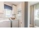 Well-lit laundry room features modern washer and dryer units and ample cabinet space at 2046 Sunset Preserve Way, Port Charlotte, FL 33953