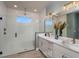 Modern bathroom with a glass-enclosed shower, double vanity, and stylish fixtures at 236 Vistera Blvd, Nokomis, FL 34275
