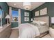 Comfortable bedroom with large window, soft lighting, and neutral decor at 236 Vistera Blvd, Nokomis, FL 34275