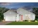 Charming single-story home featuring a two-car garage, well-manicured lawn, and inviting front entrance at 236 Vistera Blvd, Nokomis, FL 34275