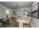 Beautiful home office featuring stylish decor, comfortable seating, large window and modern desk at 236 Vistera Blvd, Nokomis, FL 34275