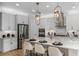 Open kitchen boasts stainless steel appliances and a large island, perfect for entertaining at 236 Vistera Blvd, Nokomis, FL 34275