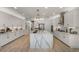 Spacious kitchen with island, pendant lighting, stainless steel appliances, and white cabinetry at 236 Vistera Blvd, Nokomis, FL 34275