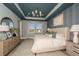 Spacious main bedroom with tray ceiling, patterned wallpaper, large windows and neutral color palette at 236 Vistera Blvd, Nokomis, FL 34275