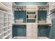 Custom walk-in closet featuring ample shelving, drawers, and hanging space for organization at 236 Vistera Blvd, Nokomis, FL 34275
