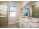 Modern bathroom features glass shower, and a white marble vanity that provides a luxurious and functional space at 237 Vistera Blvd, North Venice, FL 34275