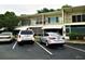 Exterior of condo building with parking spaces at 4154 57Th N St # 272, Kenneth City, FL 33709