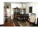 Traditional dining room with a dark wood table, chandelier, and vintage china cabinet at 4154 57Th N St # 272, Kenneth City, FL 33709