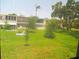 A low angle view of a building exterior with a well-manicured lawn and trees at 4154 57Th N St # 272, Kenneth City, FL 33709
