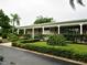 Charming building featuring a covered front porch and meticulously landscaped gardens at 4154 57Th N St # 272, Kenneth City, FL 33709