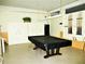 Community game room featuring a pool table, storage lockers, and cue rack at 4154 57Th N St # 272, Kenneth City, FL 33709