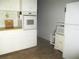 Functional kitchen with white cabinets and appliances, offering lots of storage space at 4154 57Th N St # 272, Kenneth City, FL 33709