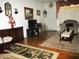 Inviting living room with wood floors, patterned rug, and a cozy armchair at 4154 57Th N St # 272, Kenneth City, FL 33709